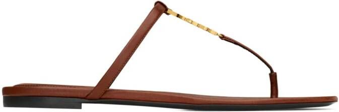 Saint Laurent Cassandra leather flip flops Brown